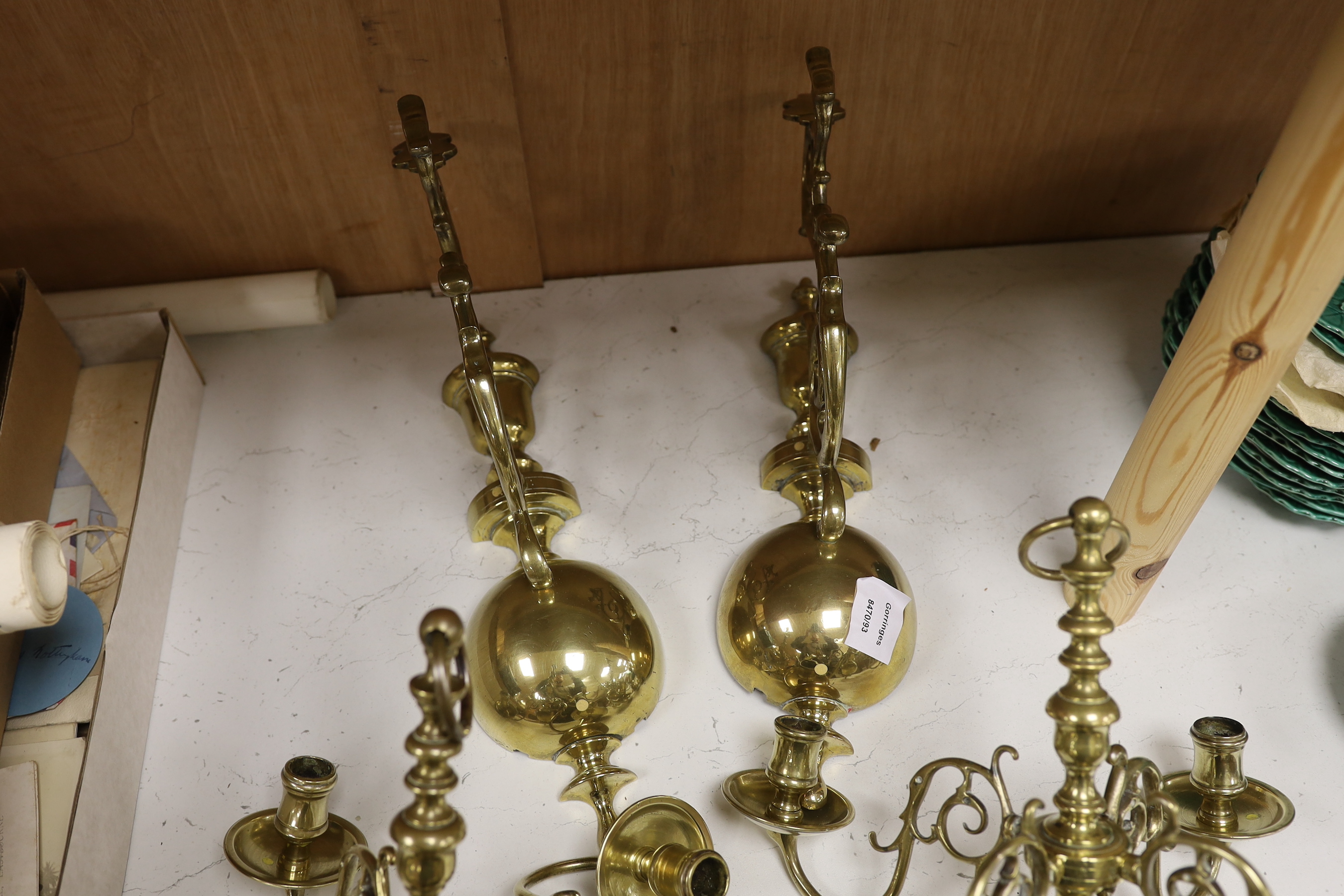 A pair of 19th century Dutch brass wall lights, each formed as a four branch chandelier with baluster stems supported by matching brackets, 36cm high